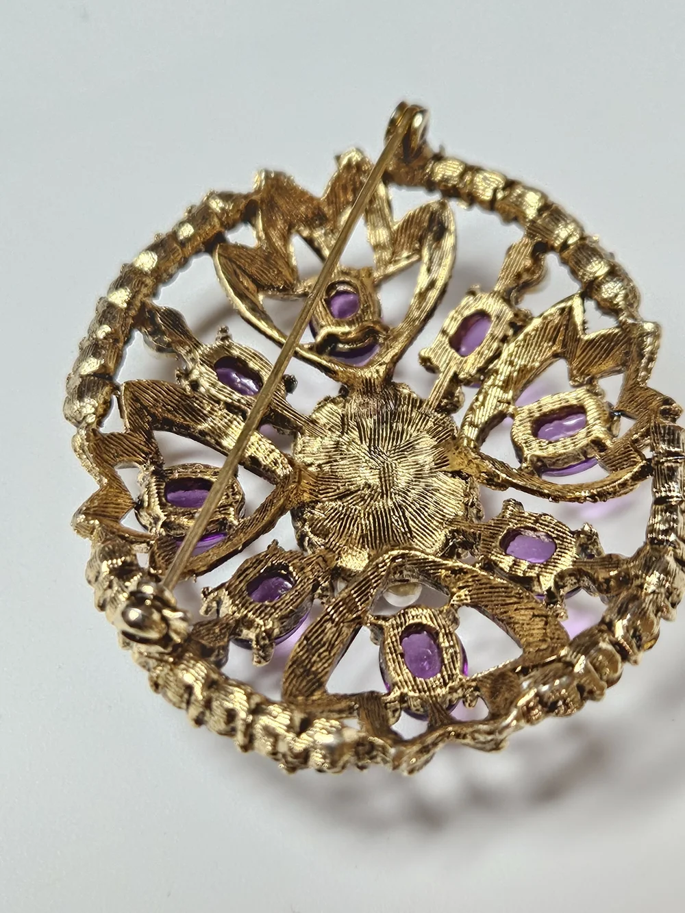 Gold-Tone Brooch with Purple Cabochons and Pearl Halo